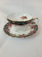 Vintage MARCO Tea cup and saucer. Footed. Gold Gilding, black with red roses picture