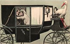 Vintage Postcard- A stork driving a wedding carriage Early 1900s picture