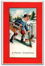 c1910's Christmas Boy Sled Basket Of Gifts Dog Embossed Posted Antique Postcard picture