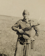 young handsome guy, soldier with AK-47. Soviet vintage photo USSR period picture