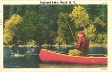 View of Man In Red Boat Fishing Along Rockland Lake, Nyack, New York Postcard picture
