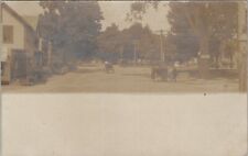 RPPC Town Street Scene Store Park Horse Carriage Dirt Road Postcard W5 picture