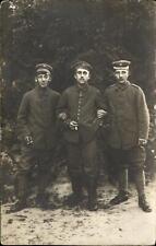 WWI German soldiers ~ smoke break in field ~ RPPC real photo postcard picture