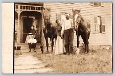 RPPC Family Posing in Front of House with Horses and Baby Unknown Location 1910s picture