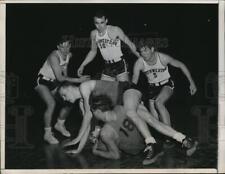 1948 Press Photo Minnesota's Peter Tapsak clatches the ball during a game picture