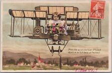 Vintage 1909 French RPPC Greetings Postcard Girl in Airplane - Colored Photo picture
