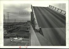 1985 Press Photo Boat passes under Highway 146 bridge drawn up by Galveston Bay picture