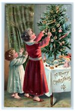 1907 Merry Christmas Mother And Child Decorating Christmas Tree Antique Postcard picture