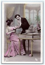 c1910's Sweet Couple Holding Hands Harpsichord Flowers RPPC Photo Postcard picture