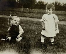 Two Children On Grass One Reaching Up B&W Photograph 2.75 x 3.75 picture