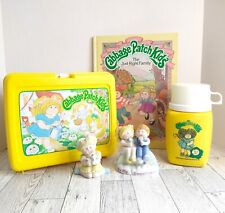 Lot of Vintage 1983-85 Cabbage Items, Lunchbox with Thermos, 2 Figurines & Book picture