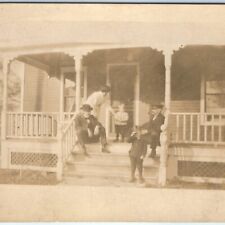 c1910s Handsome Little Boys Family Porch RPPC Conductor Man Smoking Photo A139 picture
