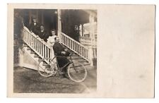 RPPC Real Photo Postcard - People standing, porch steps, bicycle, undivided back picture