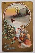 1911 Christmas Postcard - Santa Claus with Tree & a Bag Full of Toys  picture