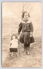 c1906~Little Girl with Doll & Stroller in Field~Victorian Portrait~RPPC Postcard picture